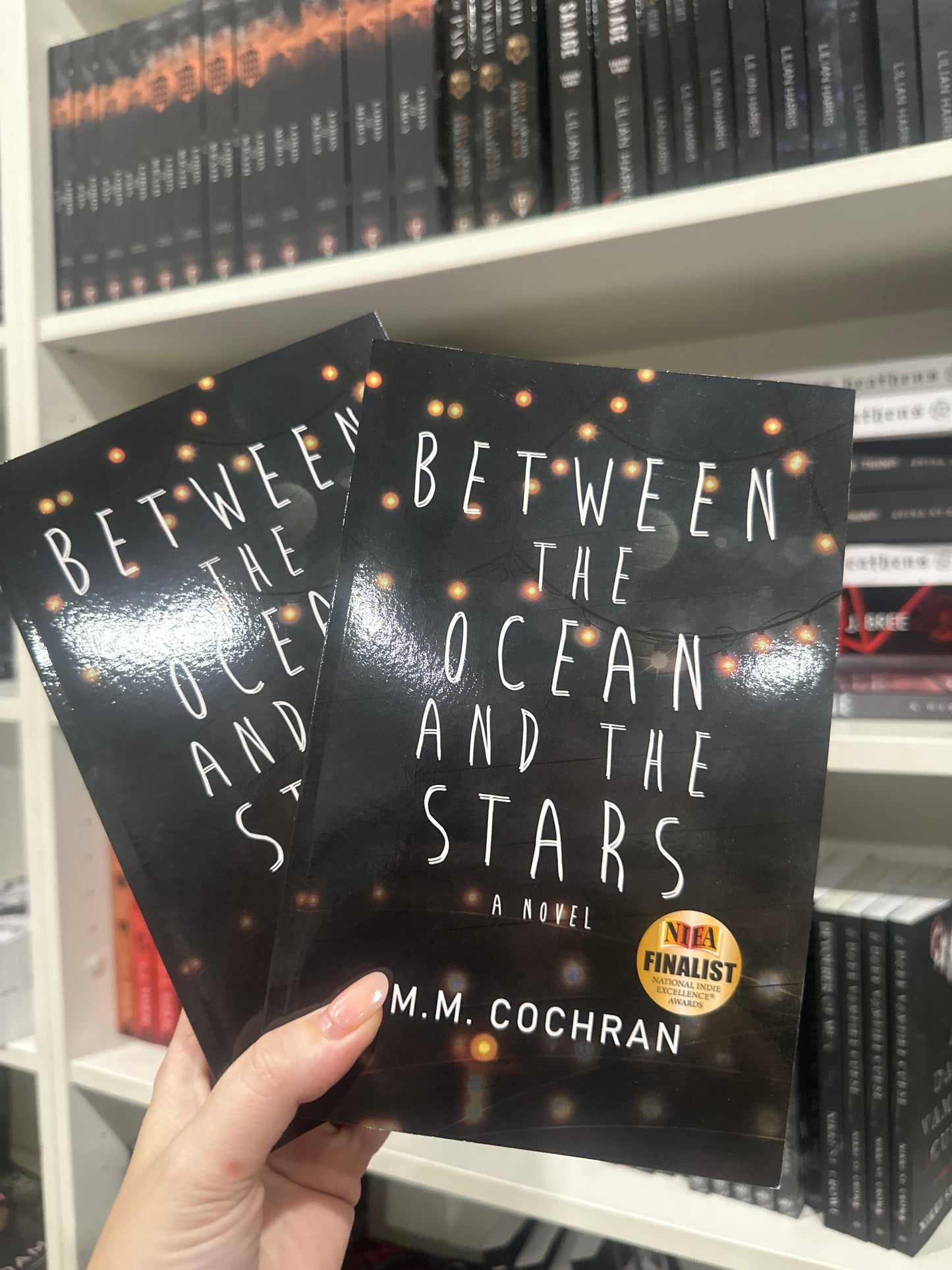 Between the ocean and the stars by M.M. Cochran