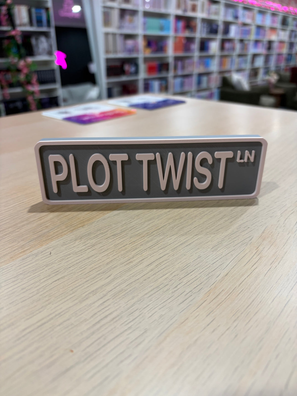 Plot Twist LN 3d printed shelf sign